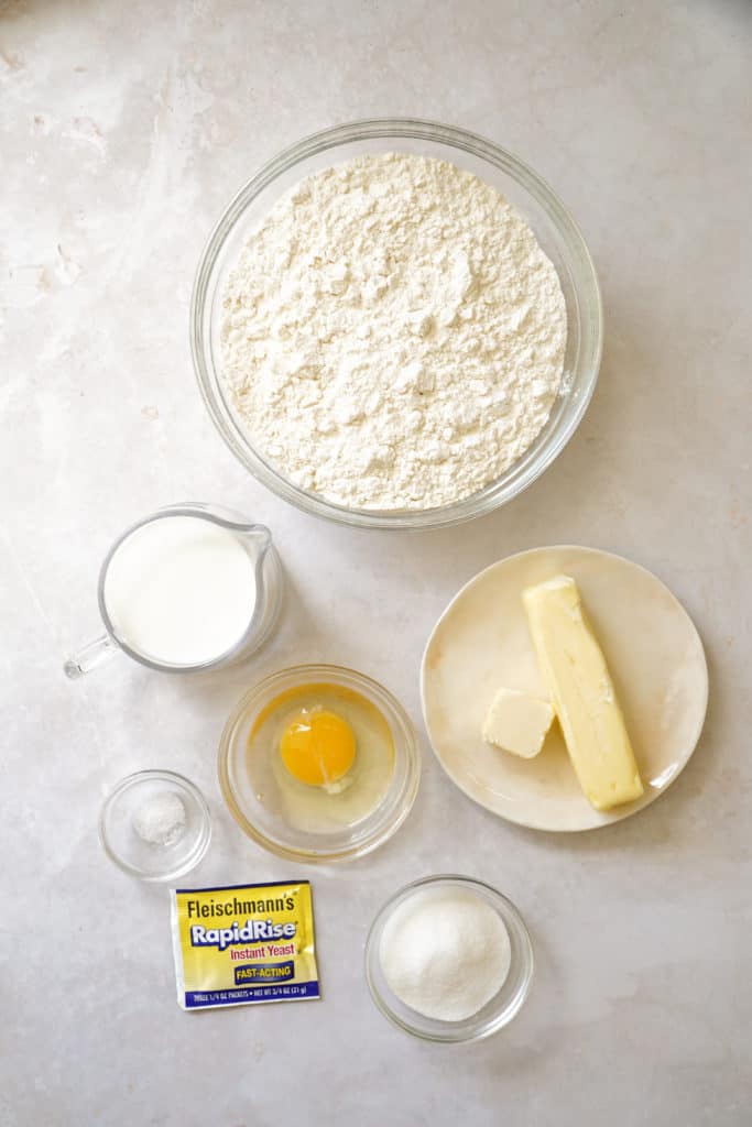 Ingredients in bowls for easy homemade cinnamon buns.
